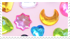 close up photo of jewel stickers over a pastel pink background